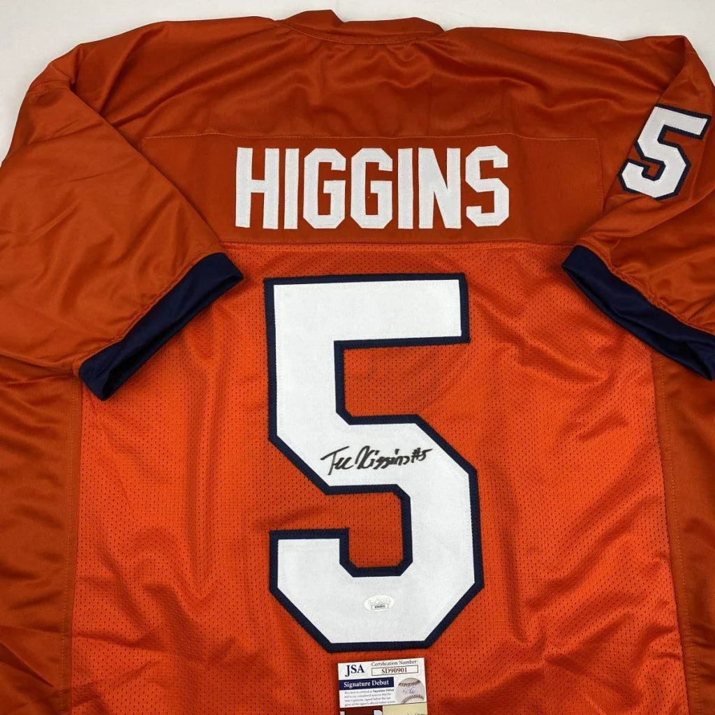 Back of autographed Clemson orange football jersey with white number 5 Higgins name and navy blue sleeve cuffs for professional sports league fans