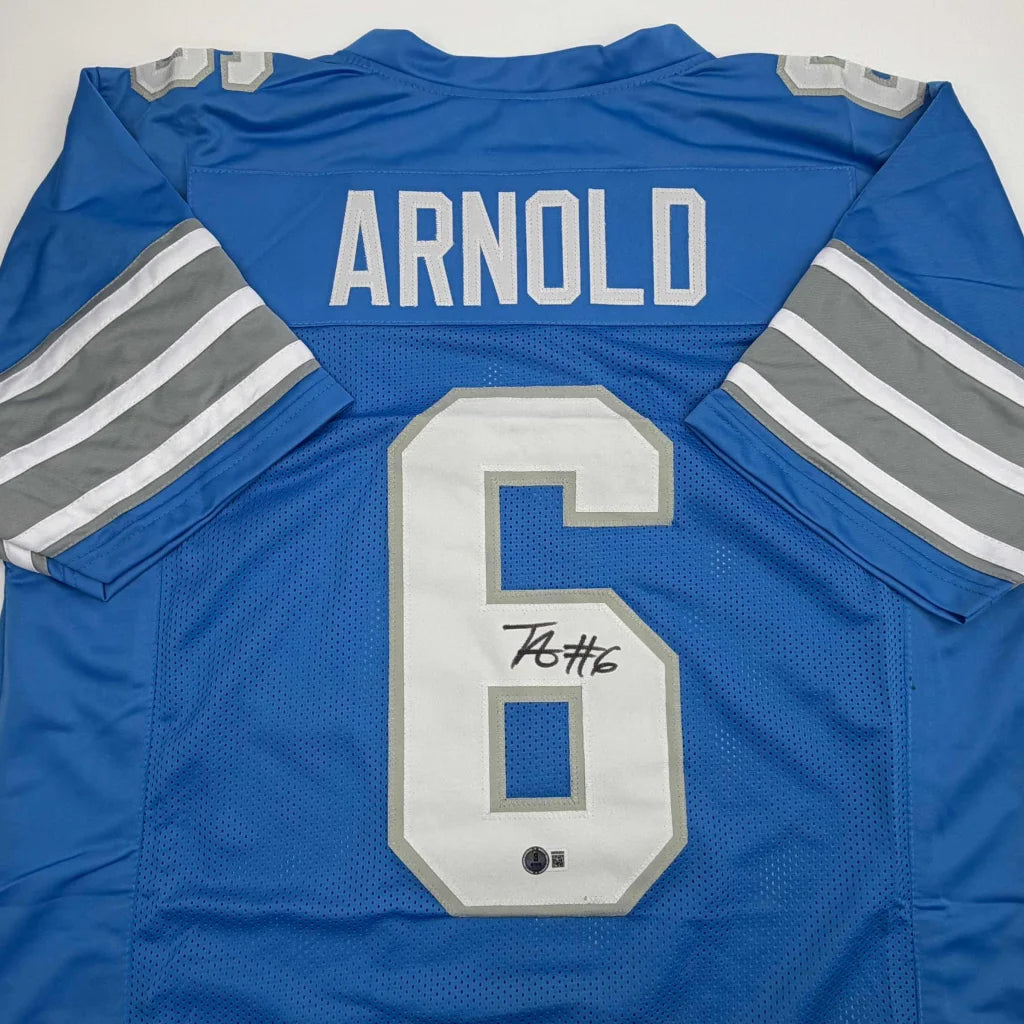 Autographed Detroit Lions blue custom jersey number 6 by Terrion Arnold