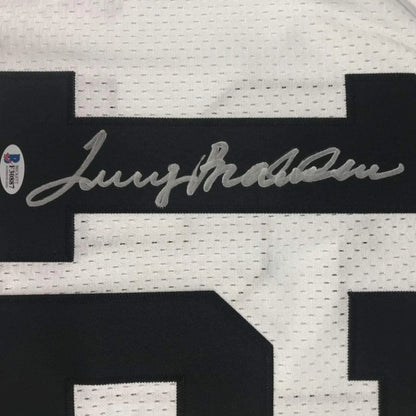 White mesh custom football jersey with black numerals and silver autograph from professional sports league player terry bradshaw