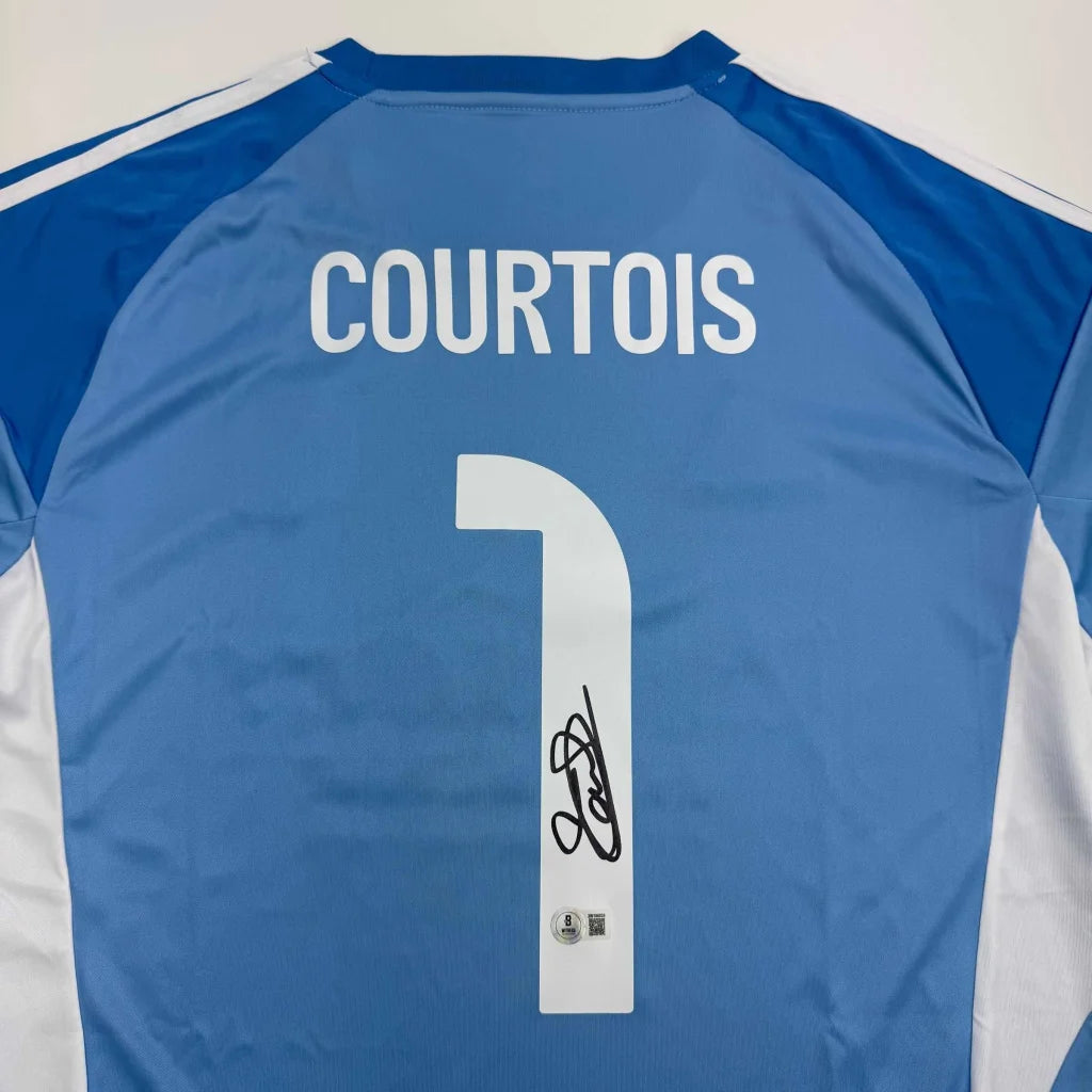 Autographed Thibaut Courtois Real Madrid light blue soccer jersey with white lettering and number, black signature on back, Beckett BAS COA