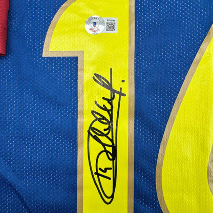 Blue custom jersey with yellow 10, signature, and authentication sticker for professional sports fans