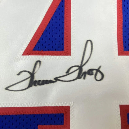 Autographed white custom jersey with red and blue accents from a professional sports league