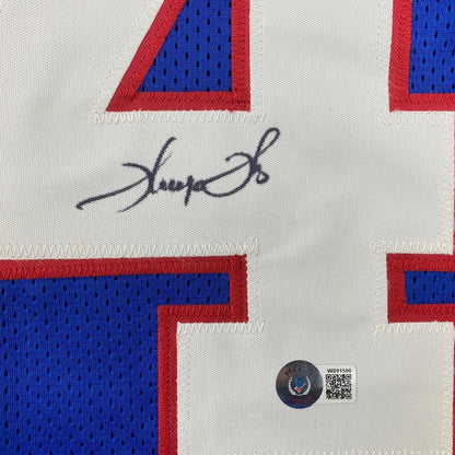 White and blue mesh custom jersey with red trim autographed by Thurman Thomas featuring Beckett BAS COA for professional sports league fans