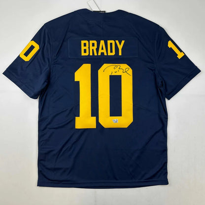 Autographed Navy Blue Brady 10 Jersey with Yellow Numbers and Third Party Authentication