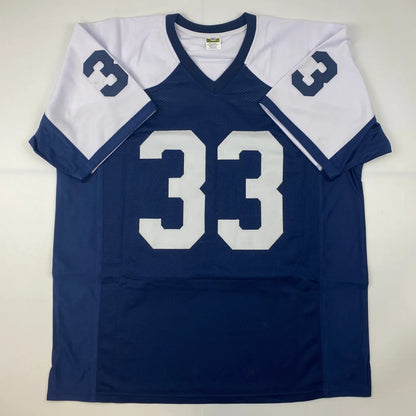 Autographed Tony Dorsett custom Dallas jersey in navy blue and white, number 33, JSA COA