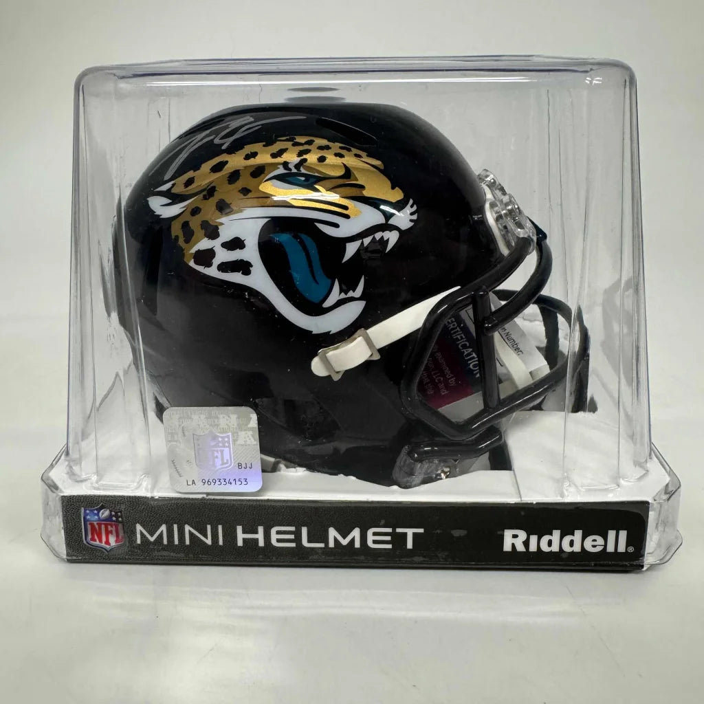 Black Jacksonville Jaguars Riddell mini helmet with third party authentication in display packaging