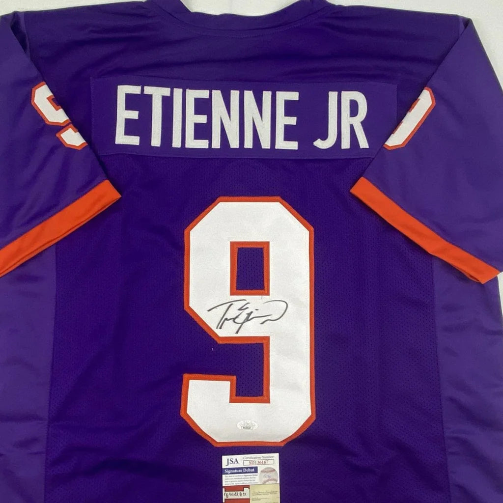 Back of autographed Travis Etienne Jr. Clemson purple custom jersey number 9