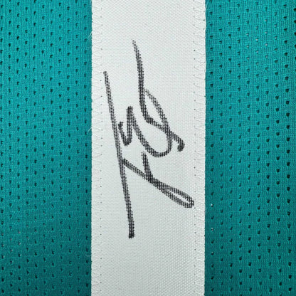 Autographed Travis Etienne Jr. Jacksonville teal custom jersey with black ink signature on white stripe, Beckett BAS COA