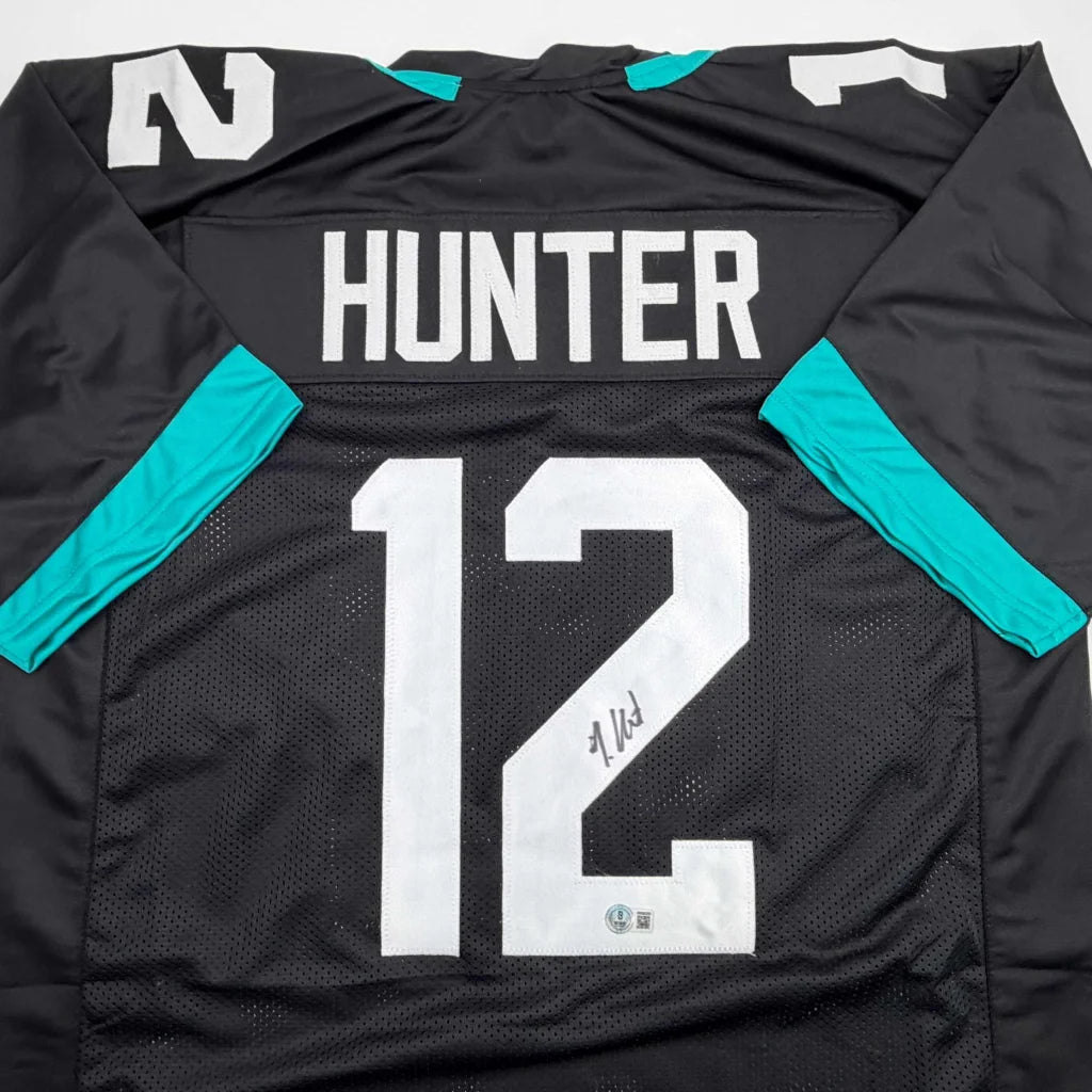 Autographed Travis Hunter Jacksonville Black Football Jersey Beckett BAS COA | Certified Authentic Signed Memorabilia | vintageantiquesgifts.com
