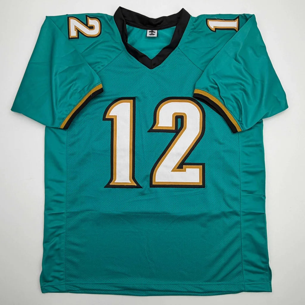Autographed Travis Hunter Jacksonville Teal Retro Football Jersey Beckett BAS COA | Authenticated Signed Sports Jersey | vintageantiquesgifts.com