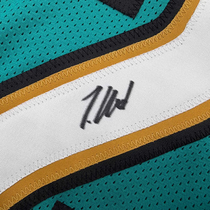 Autographed Travis Hunter Jacksonville Teal Retro Football Jersey Beckett BAS COA | Authenticated Signed Sports Jersey | vintageantiquesgifts.com