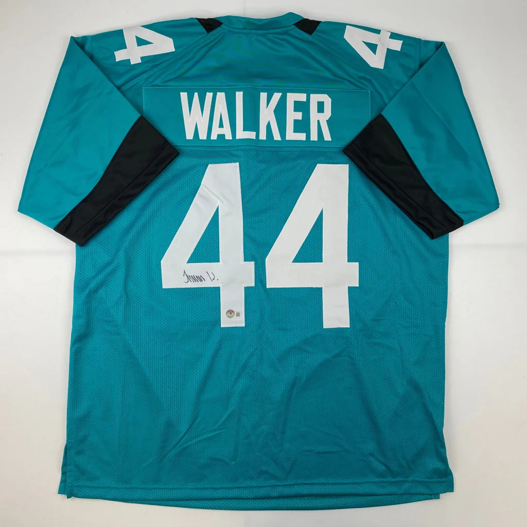 Teal football jersey with black sleeves and white numbers from Authentic WALKER 44 sports league