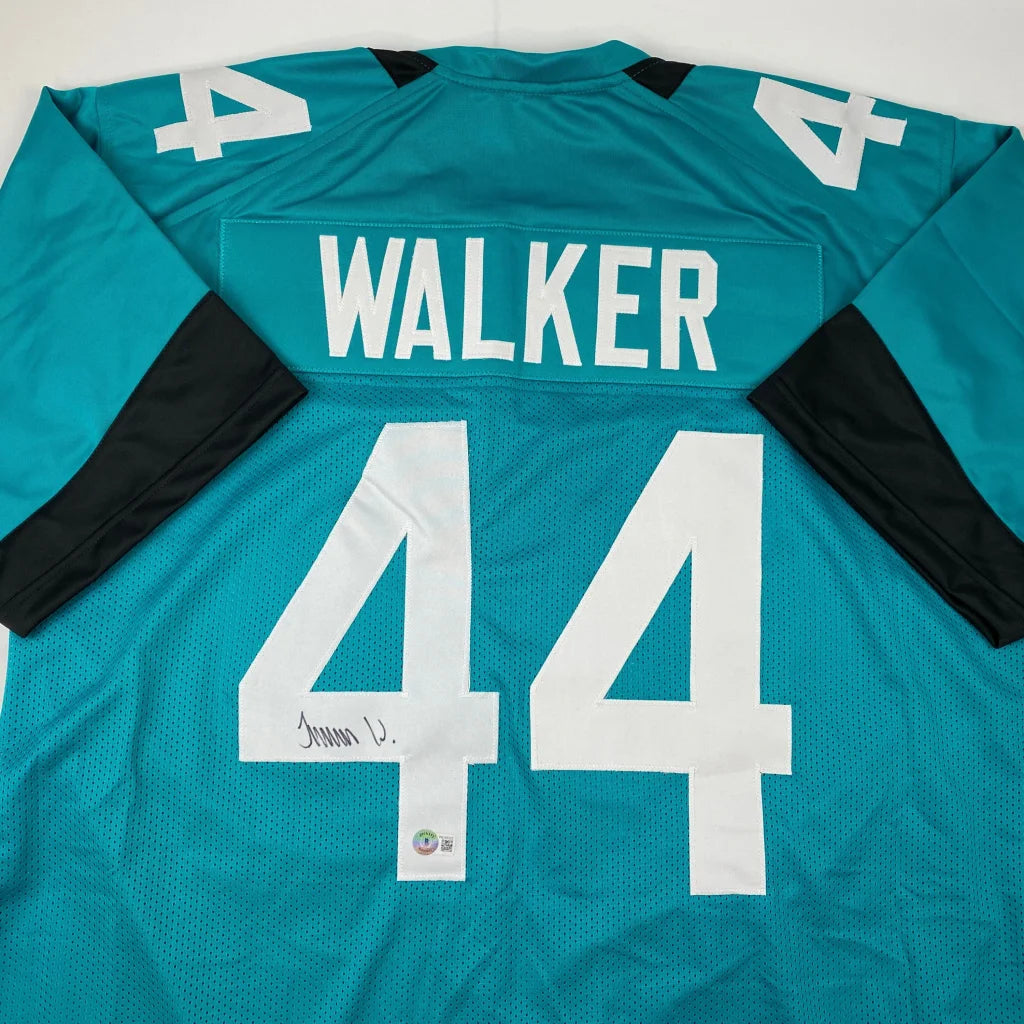 Teal professional sports league football jersey with WALKER 44 autographed for sports fans