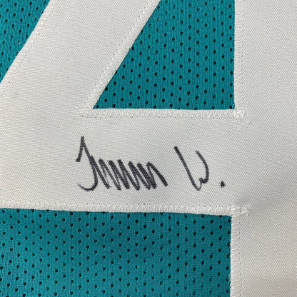 Autographed teal and white jersey from Authentic WALKER 44 professional sports league