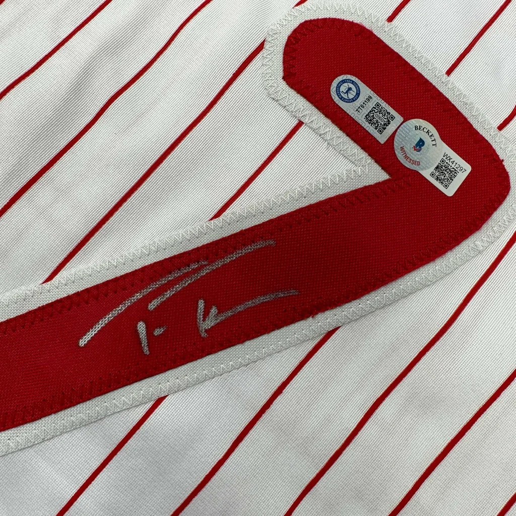 White pinstripe custom jersey with red trim and silver autograph for sports league fans