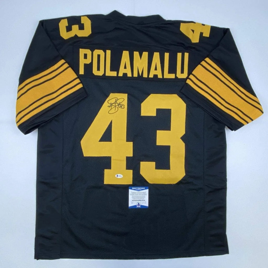 Black and gold professional sports league custom jersey signed by Troy Polamalu with authentication sticker