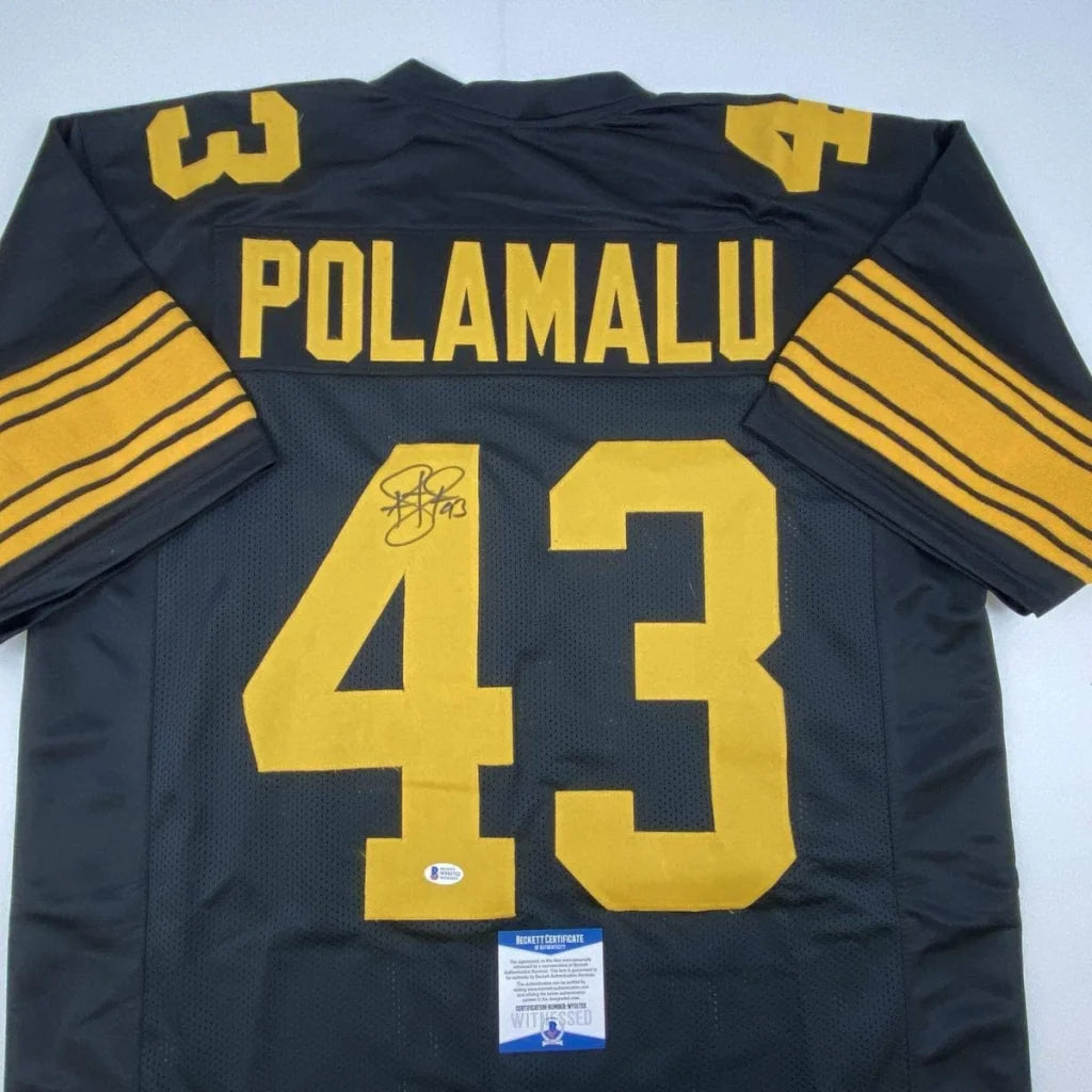 Black Troy Polamalu #43 Steelers jersey with signature and authentication stickers for professional sports fans