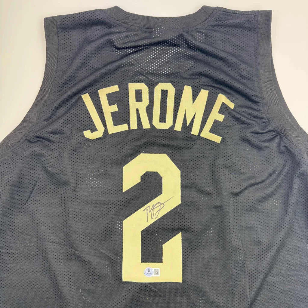 Black basketball jersey with Jerome Cleveland name and gold number 2 signature