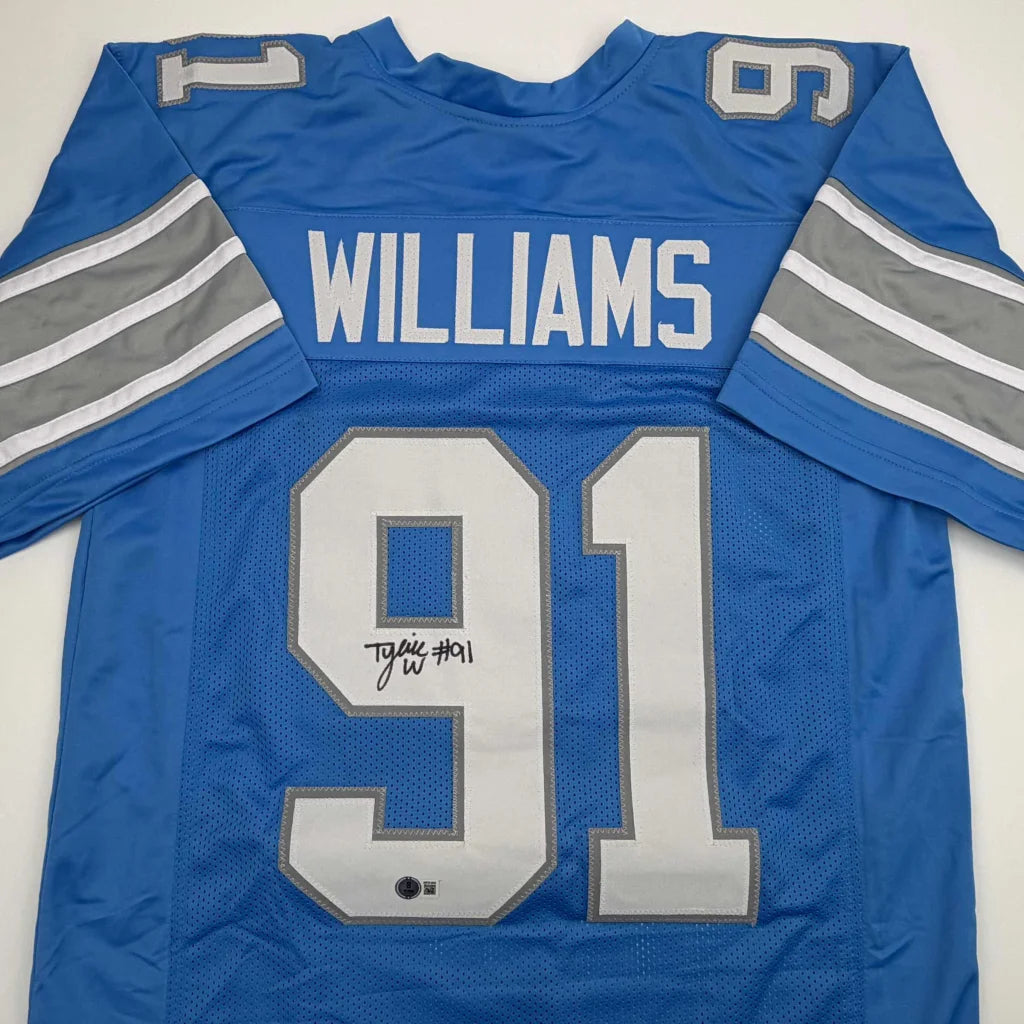 Autographed Tyleik Williams Detroit Blue Football Jersey Beckett BAS COA | Certified Authentic Signed Memorabilia | vintageantiquesgifts.com