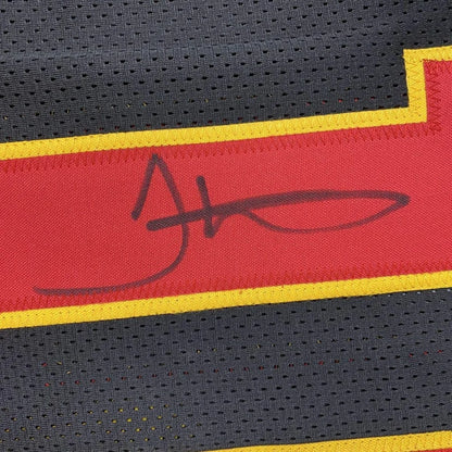 Autographed red and black kansas city football custom jersey with yellow trim and signature for professional sports league fans