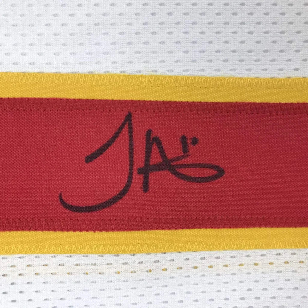 Red and yellow striped custom jersey featuring a black signature on the red stripe from professional sports league