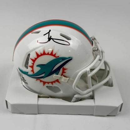 White Miami Dolphins mini football helmet with player autograph for authentic fan gear