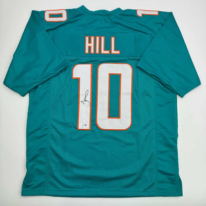 Autographed Tyreek Hill Miami Teal Football Jersey Beckett BAS COA | Hall of Fame Sports Memorabilia | vintageantiquesgifts.com