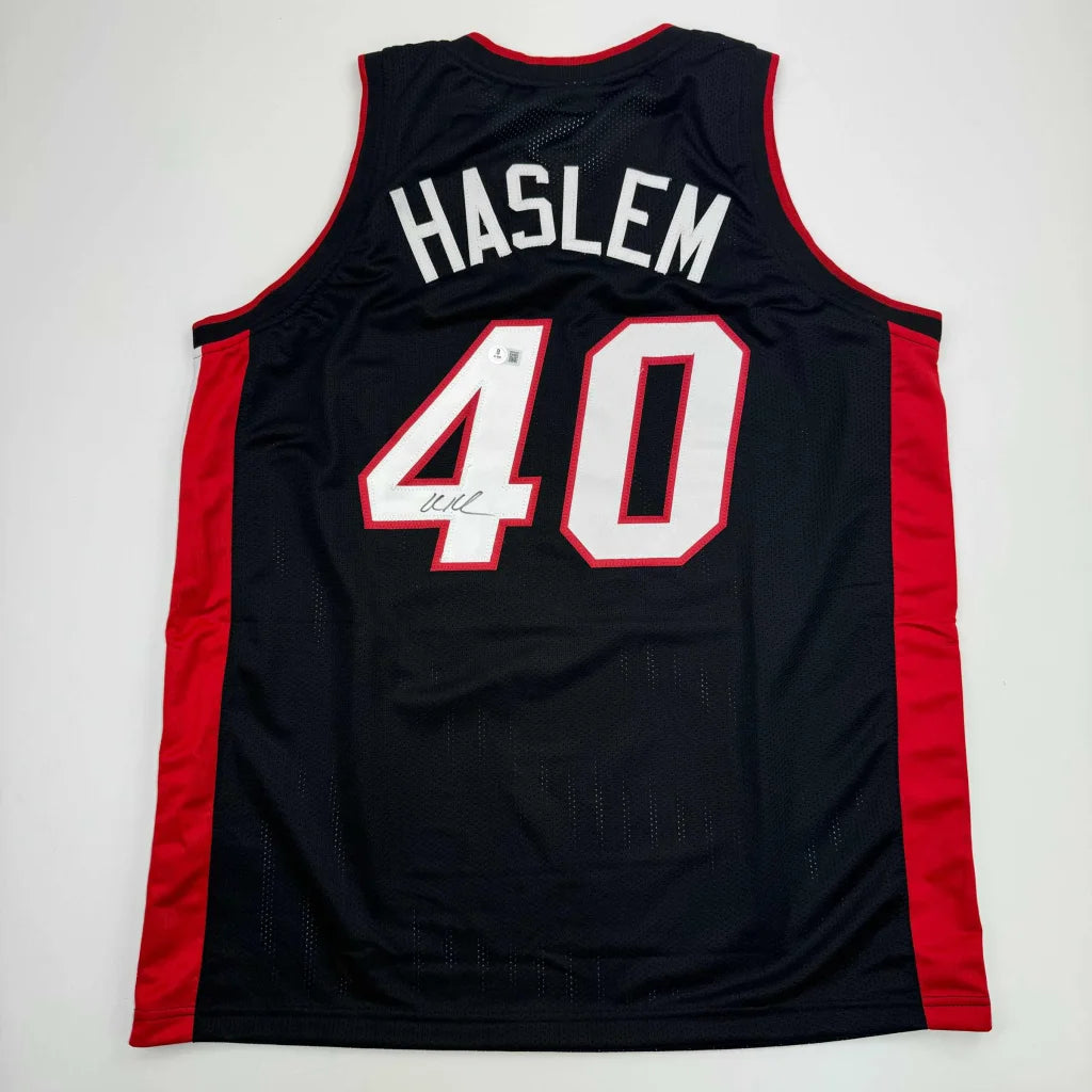 Black and red professional sports league basketball jersey with HASLEM 40 and Beckett BAS COA