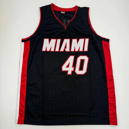 Black Miami Heat basketball jersey with red and white trim from Authentic Haslem professional sports league with Beckett BAS COA