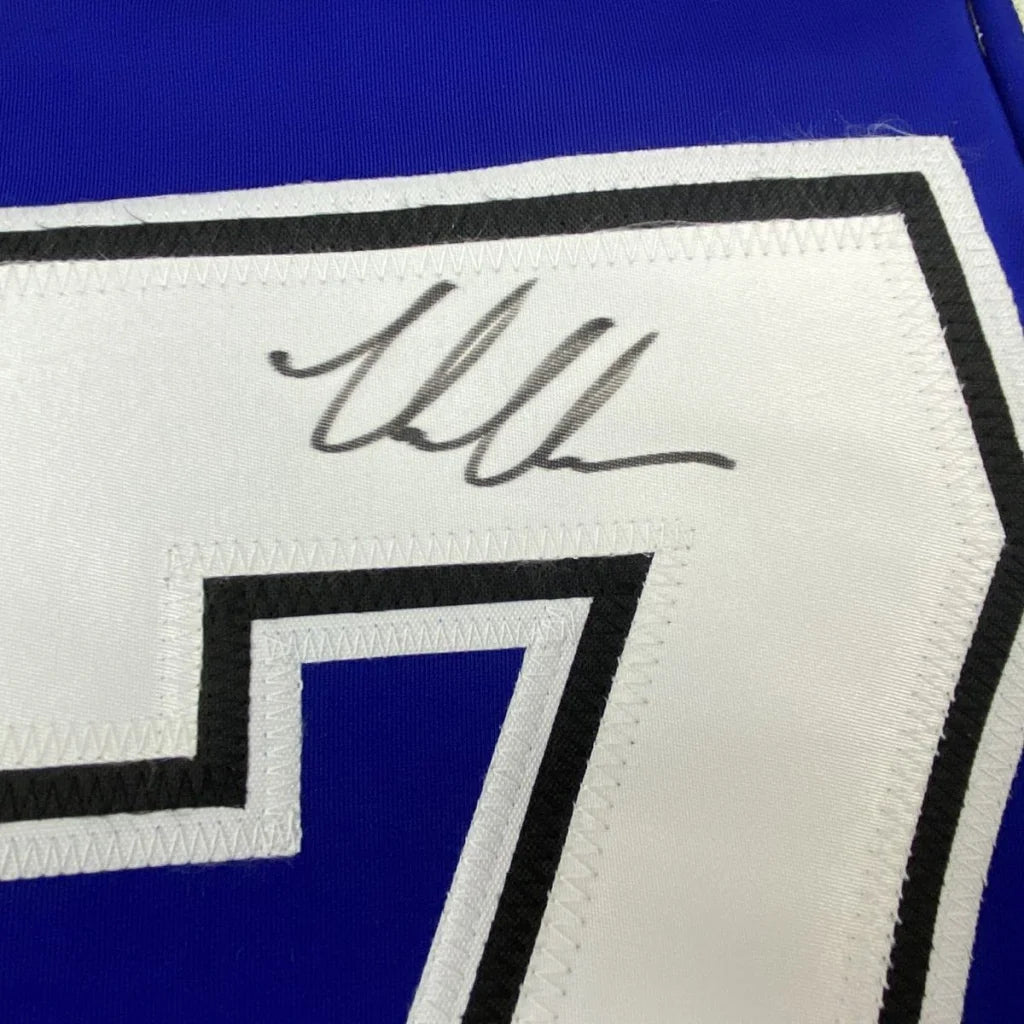 Autographed blue and white professional sports league custom jersey with number 7