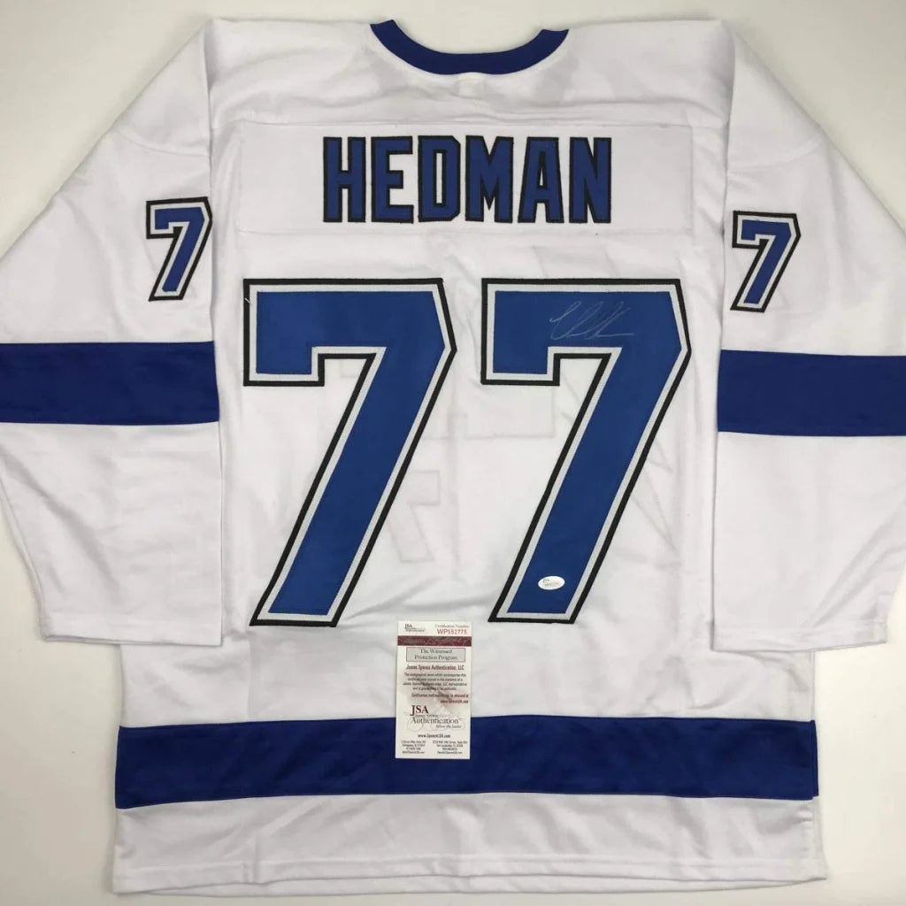 White custom HEDMAN 77 jersey signed, perfect for professional sports league fans