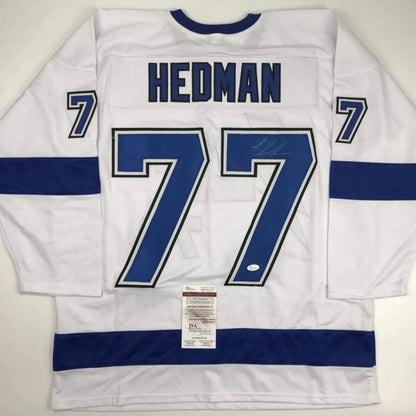 White custom HEDMAN 77 jersey signed, perfect for professional sports league fans