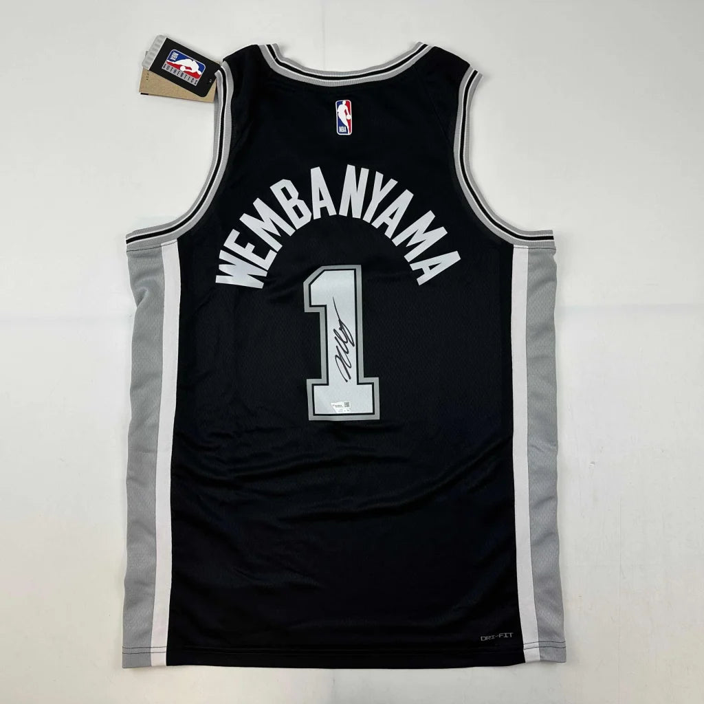 Black Wembanyama basketball jersey with third party authentication and Wembanyama 1 on back