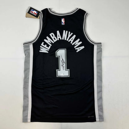 Black Wembanyama basketball jersey with third party authentication and Wembanyama 1 on back
