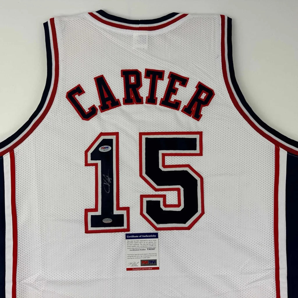 White mesh basketball jersey with CARTER 15, autograph, authenticity tag, perfect for sports league fans