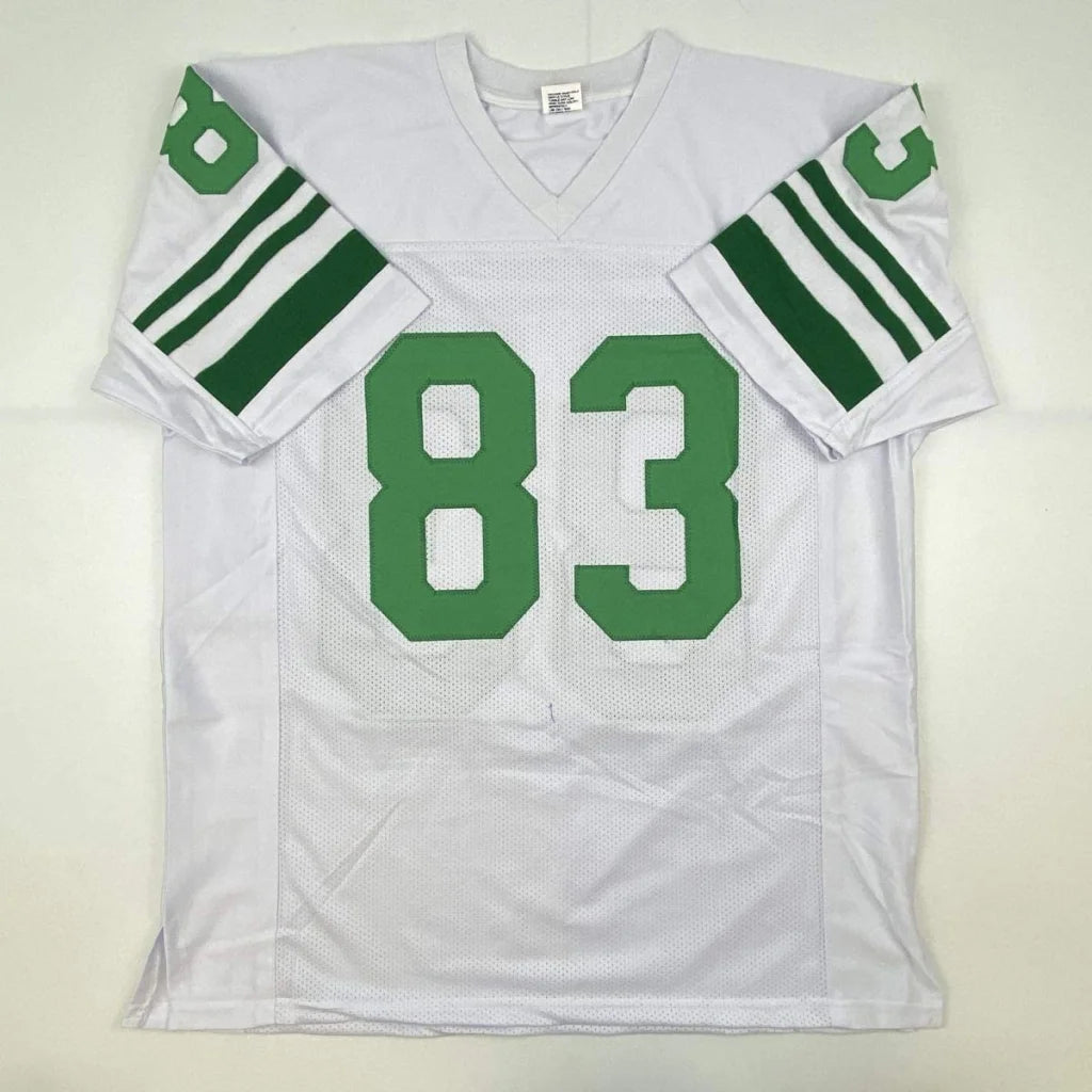 White football jersey with green number 83 and striped sleeves from professional sports league