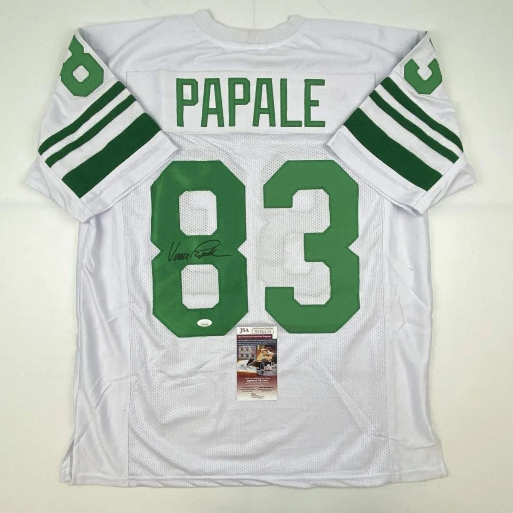 White long-sleeved custom jersey with green trim and signature from professional sports league