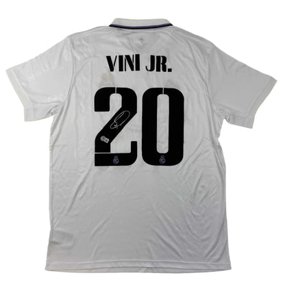 White Real Madrid jersey with VINI JR 20 and third party authentication for authenticity