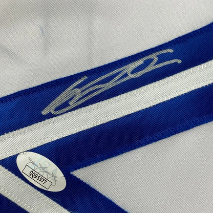 White and blue striped custom jersey with silver signature and authentication sticker