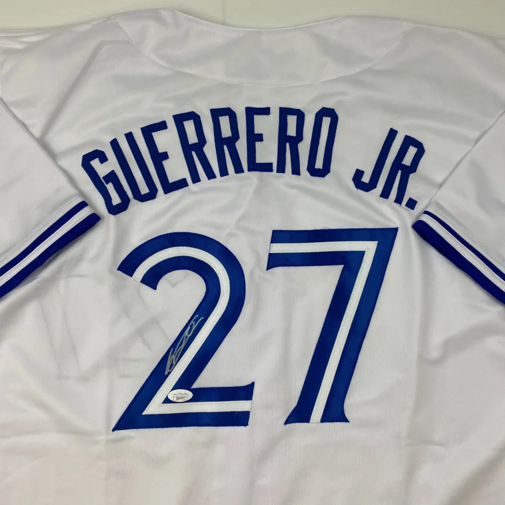 White baseball jersey with blue trim and numerals from Guerrero Jr Custom Jersey for professional sports league