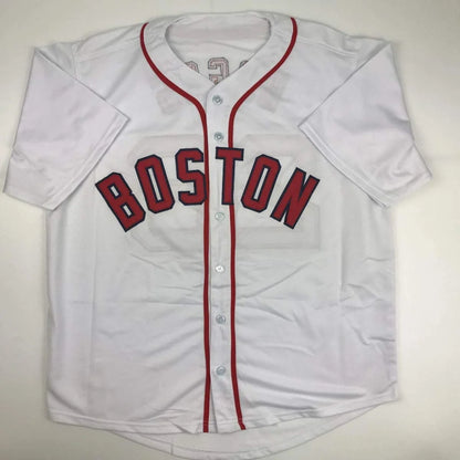 White Wade Boggs Boston jersey with red trim and BOSTON lettering, authenticated and signed