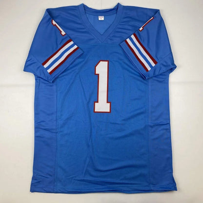 Blue Houston jersey with number 1 and striped sleeves from Warren Moon HOF signed with JSA COA