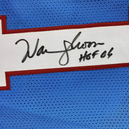 Autographed Warren Moon HOF Houston Blue Jersey with JSA COA on display