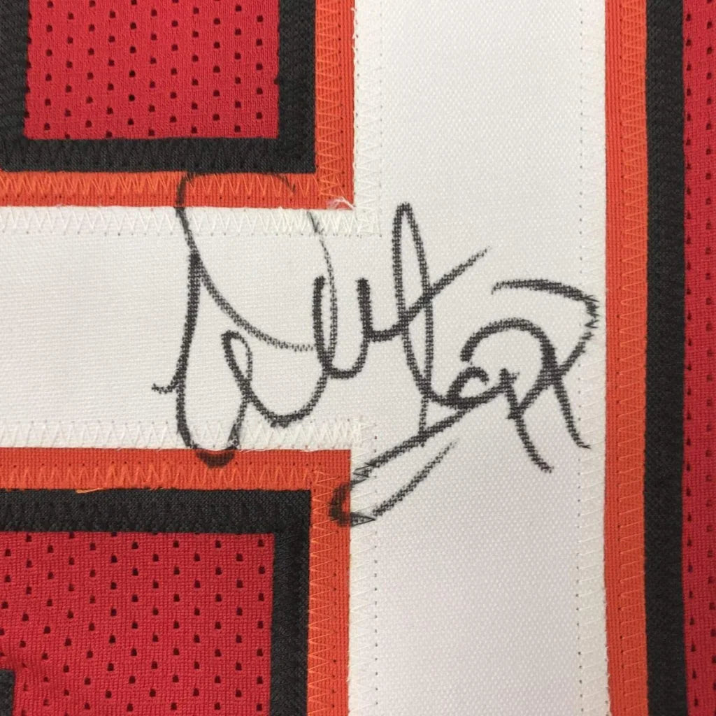 Autographed black ink signature on white mesh tampa bay red football custom jersey with red and orange trim from professional sports league