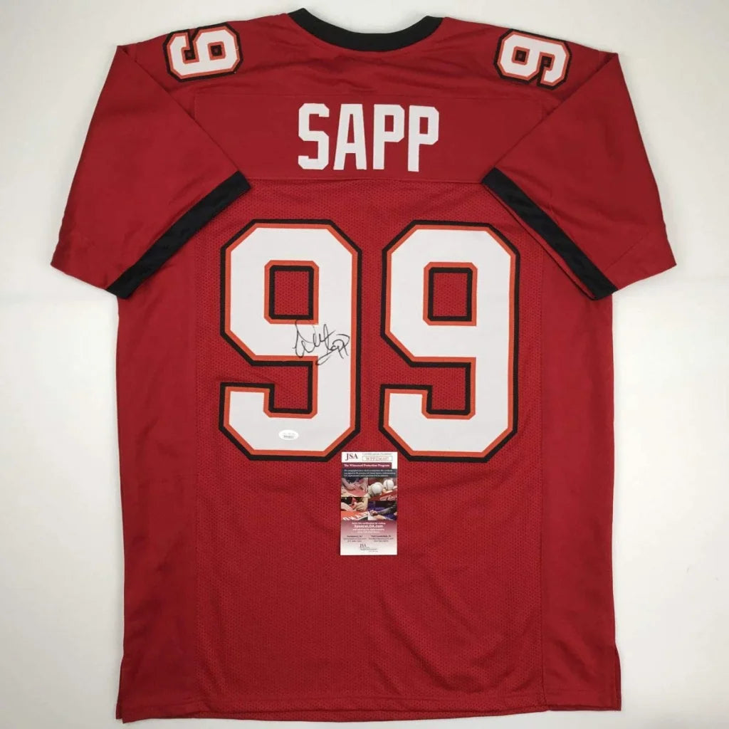 Back of a red tampa bay red football jersey with white and black trim featuring sapp 99 autographed for professional sports fans