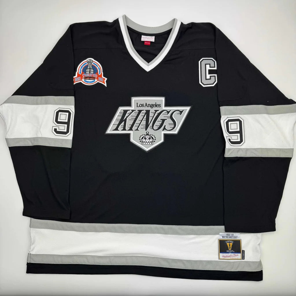 Black Los Angeles Kings jersey with number 9 and captain’s C, third party authentication