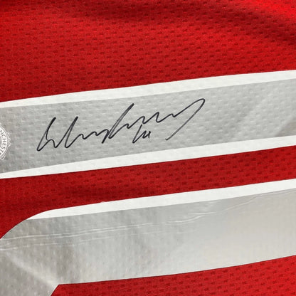 Red fabric with gray and white stripe and black autograph, authentic third party authentication