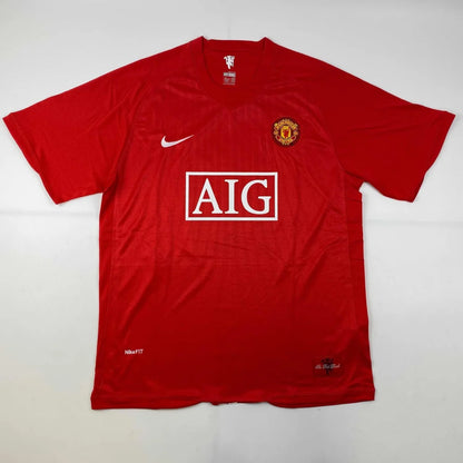 Red short-sleeved football jersey with team crest and sponsor logo, third party authentication