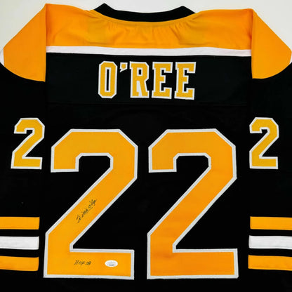 Black and gold custom hockey jersey with number 22 from a pro sports league collectible