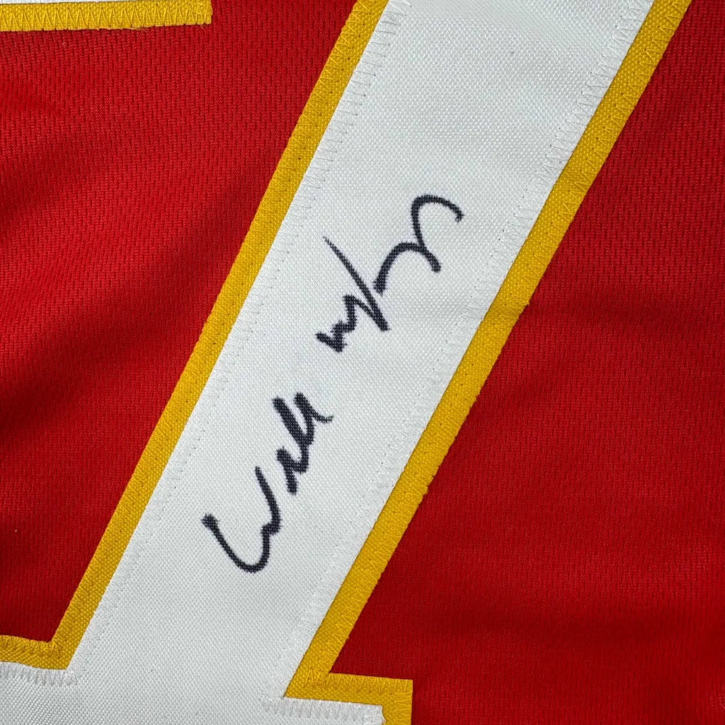 Red and white custom jersey with autograph from a professional sports league player